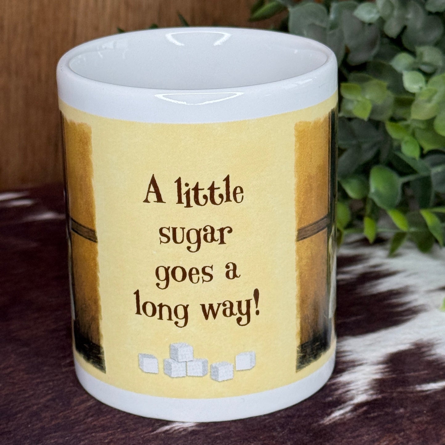 Leanin’ Tree “A Little Sugar Goes a Long Way!” Ceramic Mug Artwork by Lesley Harrison