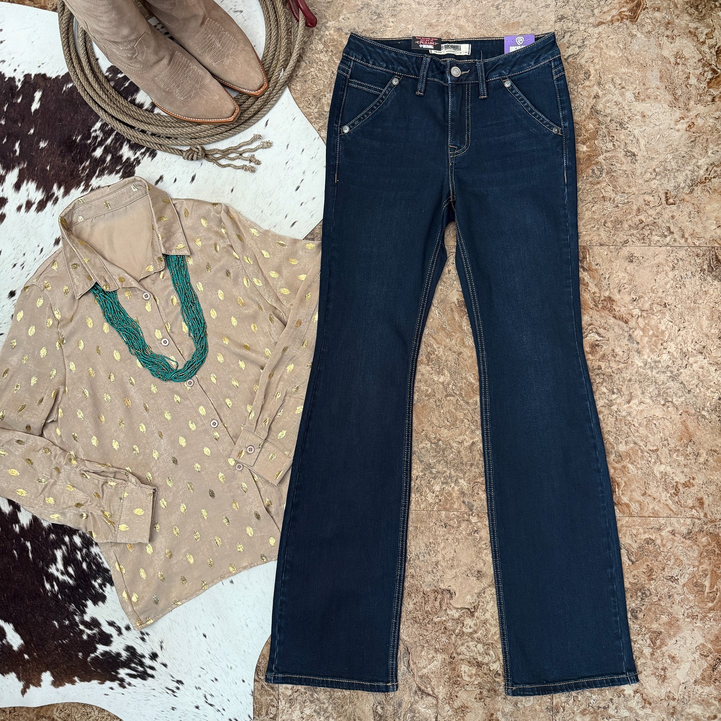 Front full view showing mid rise fit, dark wash denim, and front pockets with concho accents and turquoise stone detail